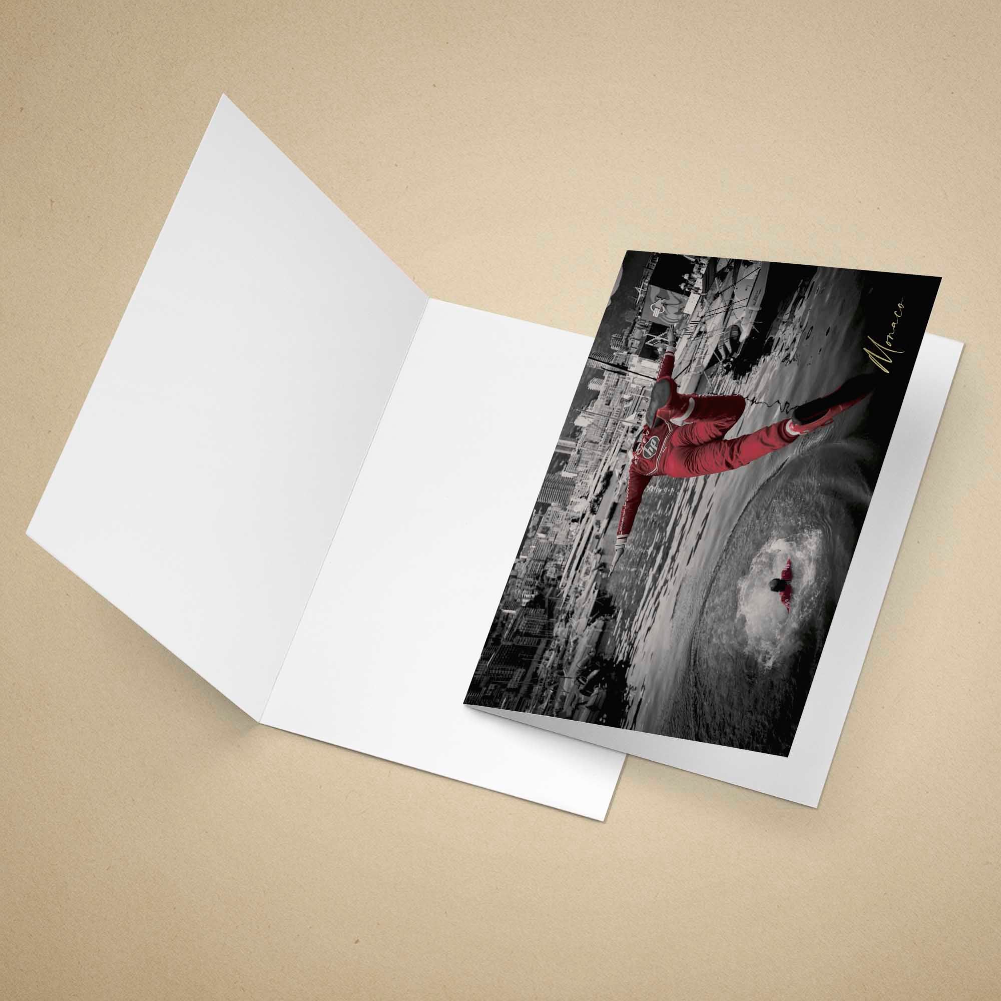 Greeting card with Charles Leclerc on a black and white background, placed on an open white envelope.
