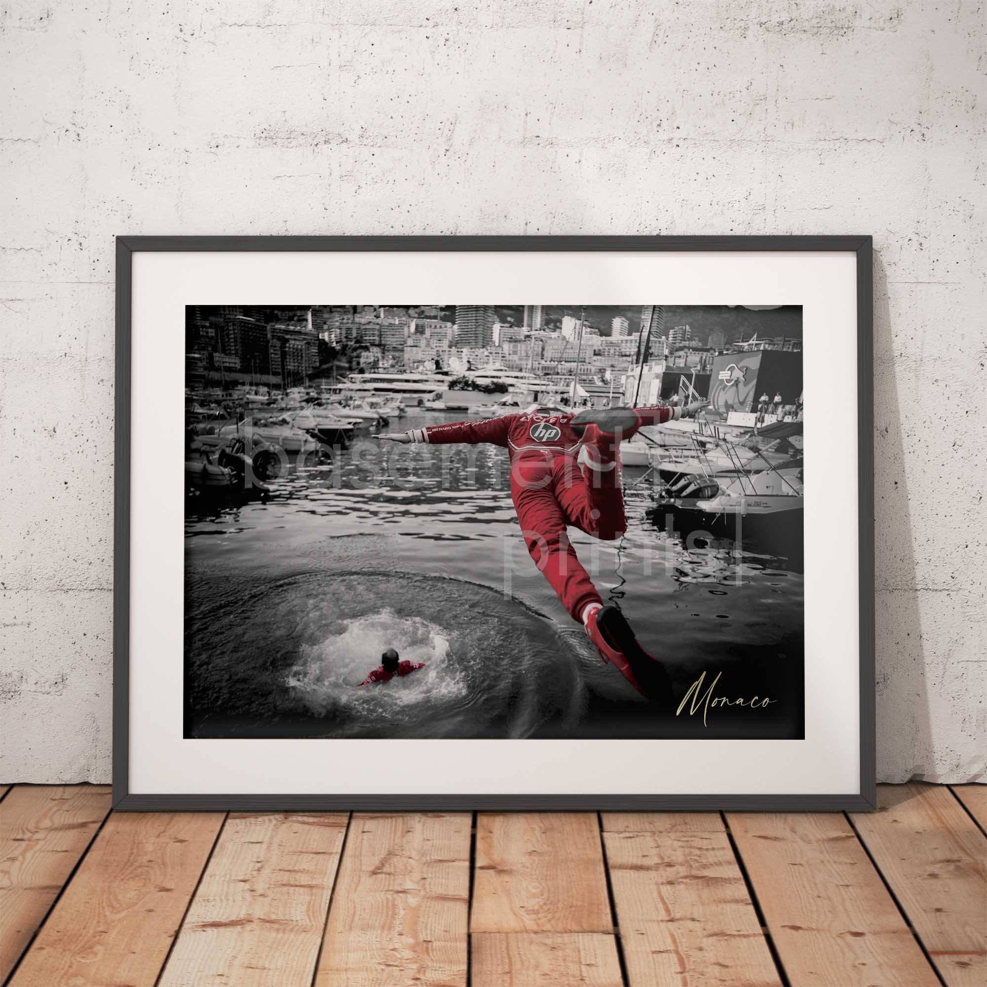 Photograph of a Charles Leclerc diving in to the Monaco harbour
