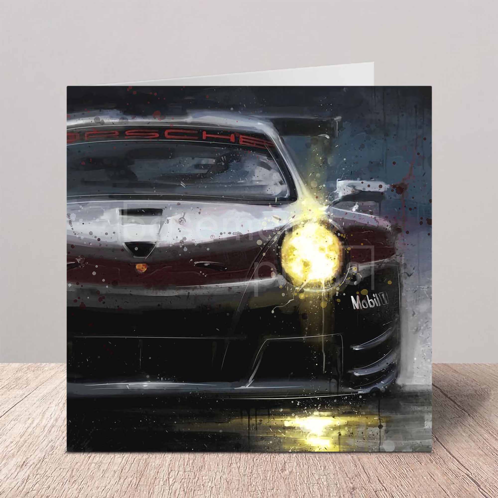 Greeting card with a Porsche 911 Supercup car design on a wooden surface.