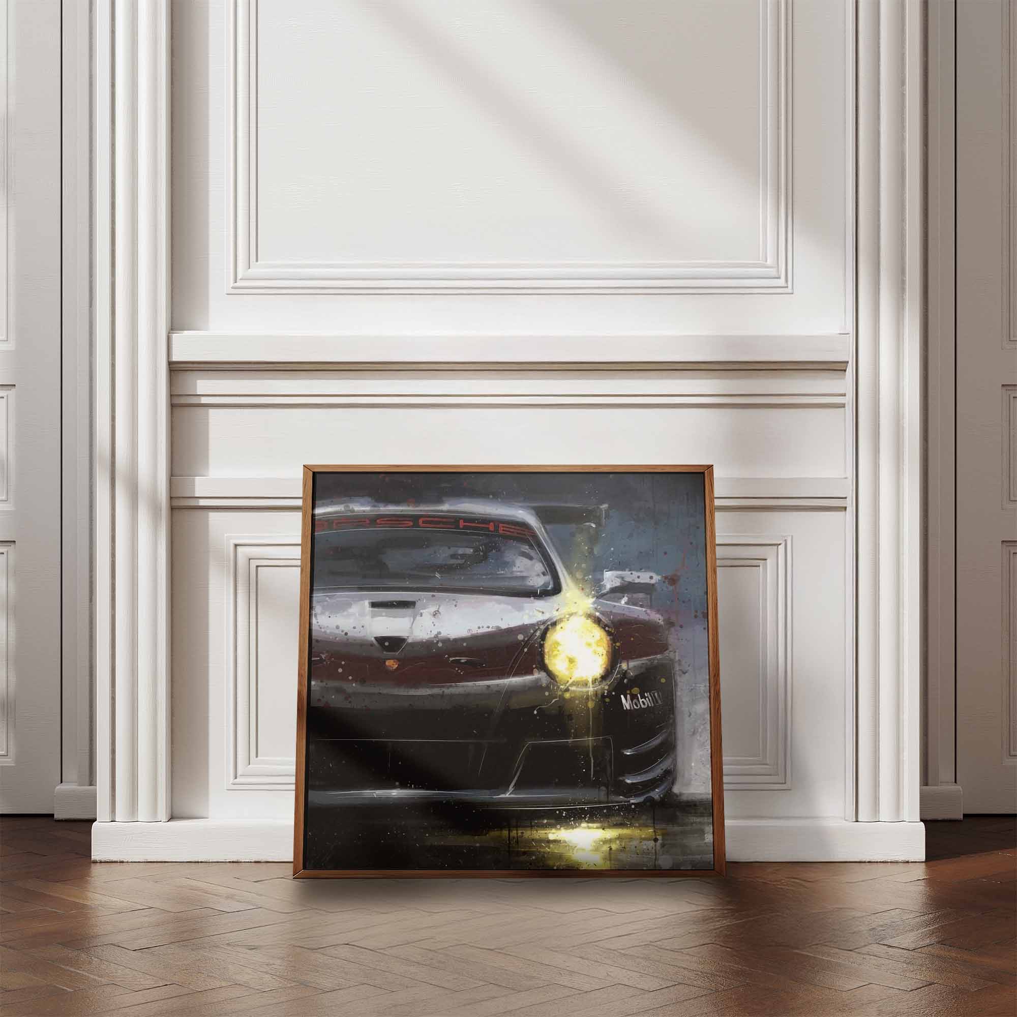 Framed artwork of a Porsche 911 Supercup car on a wall in a room with wooden flooring and white walls.