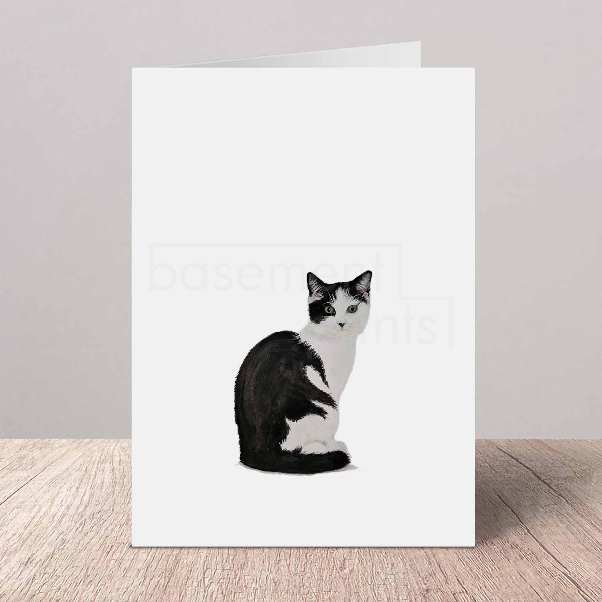 Greeting card with a black and white cat illustration on a white background
