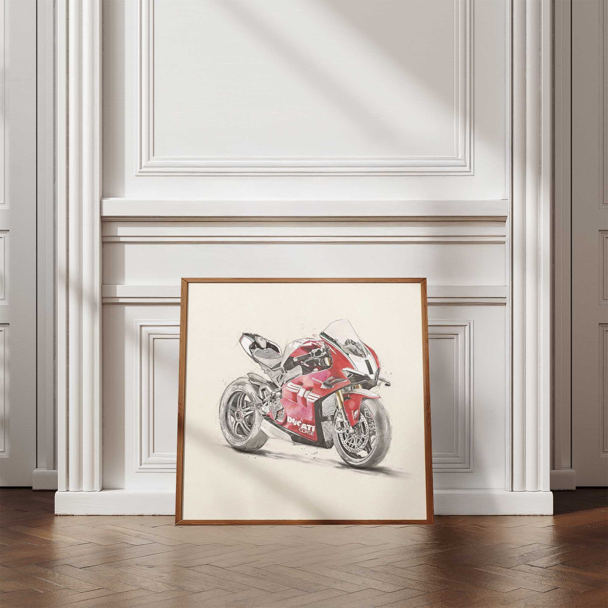 Framed artwork of a red Ducati motorcycle on a white wall.
