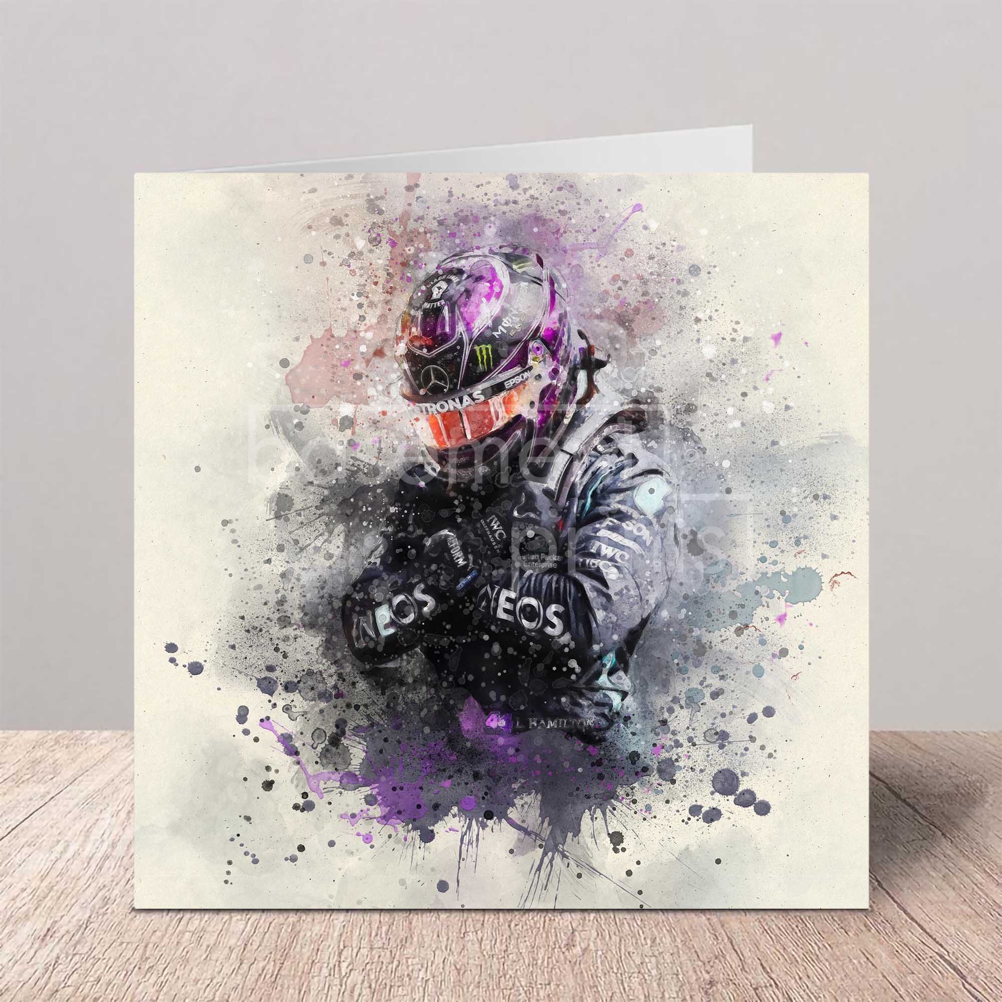 Artistic depiction of Lewis Hamilton Wakanda Forever in a helmet and suit with splatter effects on a card.
