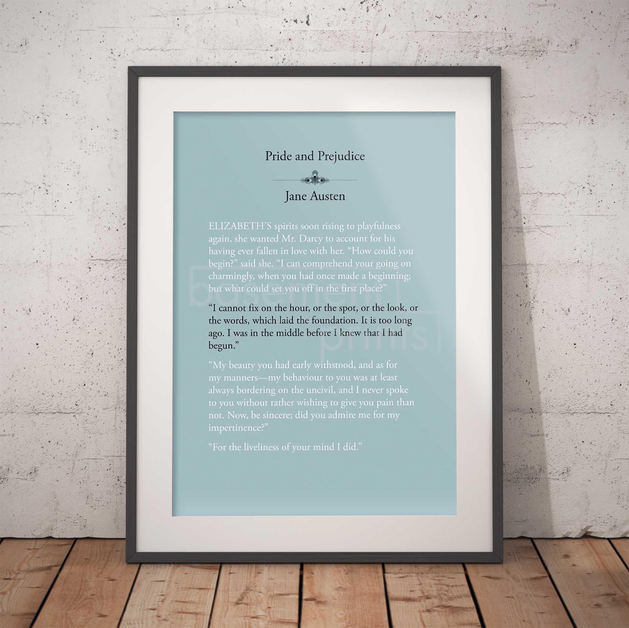 Framed text print of a quote from 'Pride and Prejudice' by Jane Austen against a brick wall.