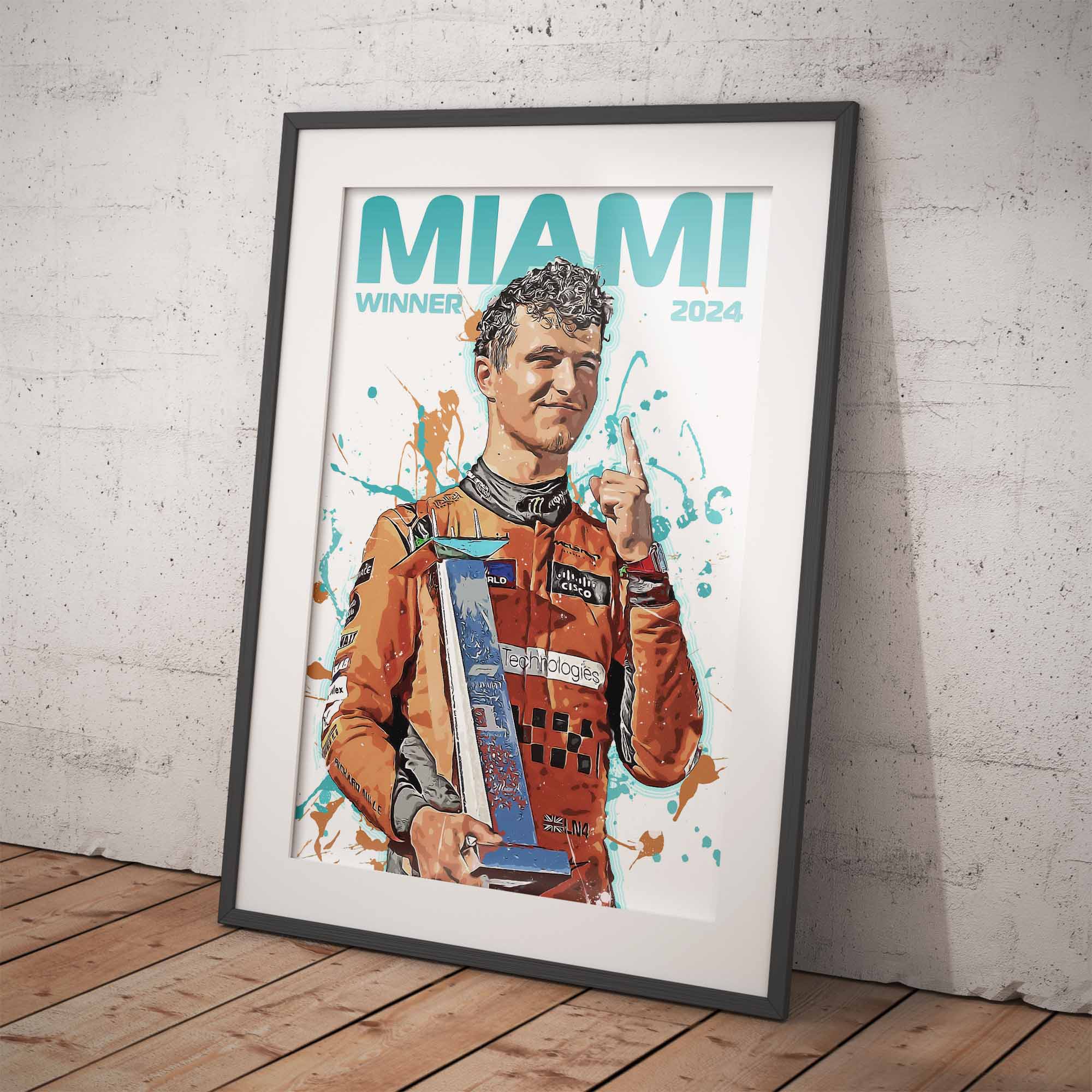 Framed poster of Lando Norris holding his trophy, with 'MIAMI WINNER 2024' text on a white background and wooden floor