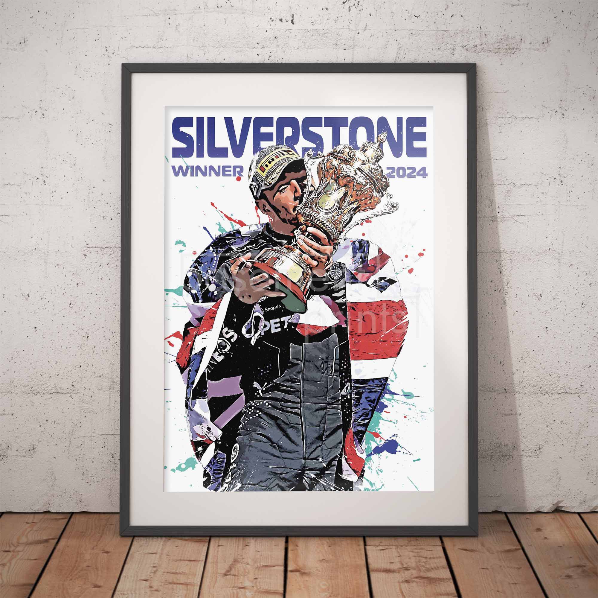 Framed poster Lewis Hamilton holding a trophy with 'Silverstone Winner 2024' text on a white brick wall.