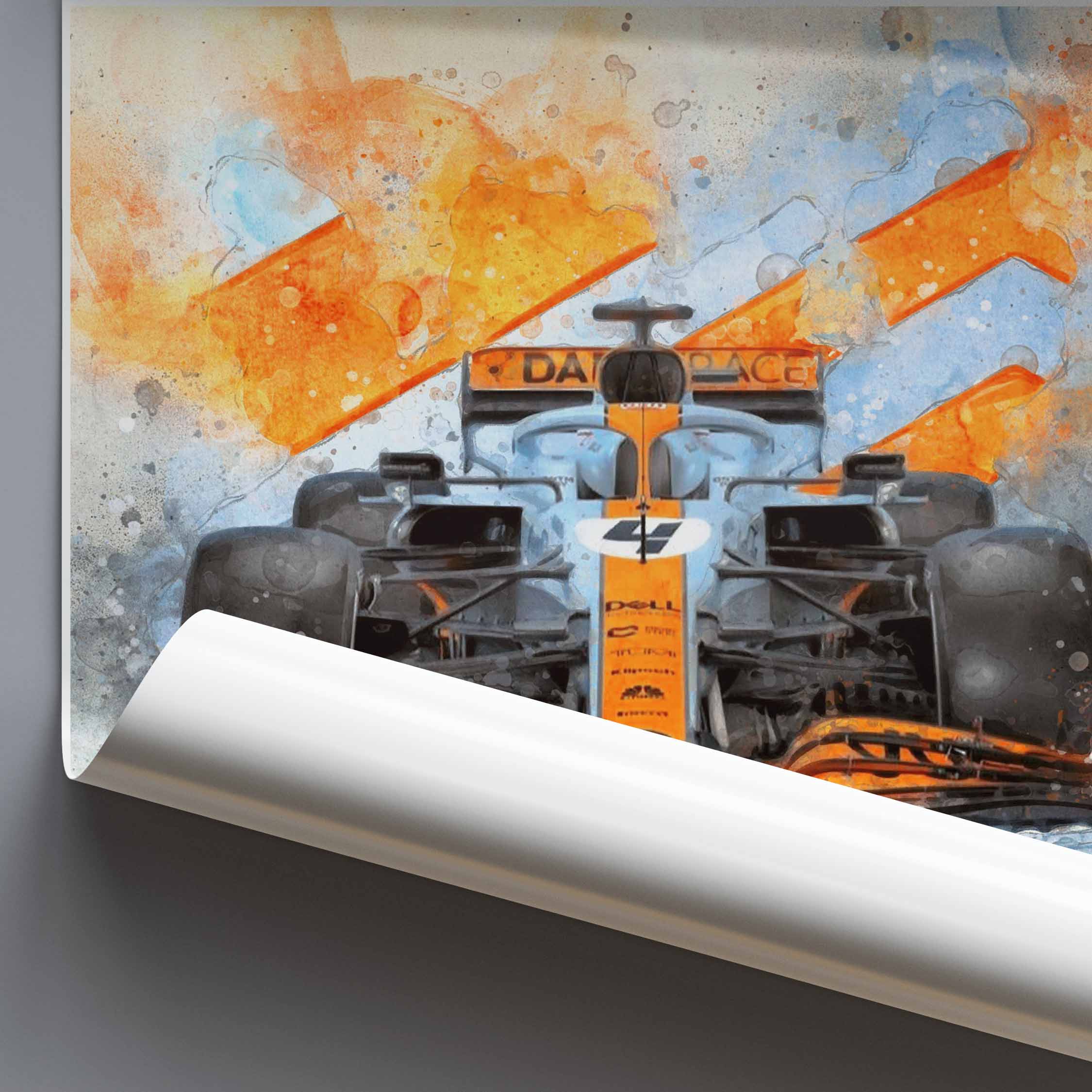 Rolled poster of a McLaren F1 car in Gulf Livery car with orange and black design on a textured background