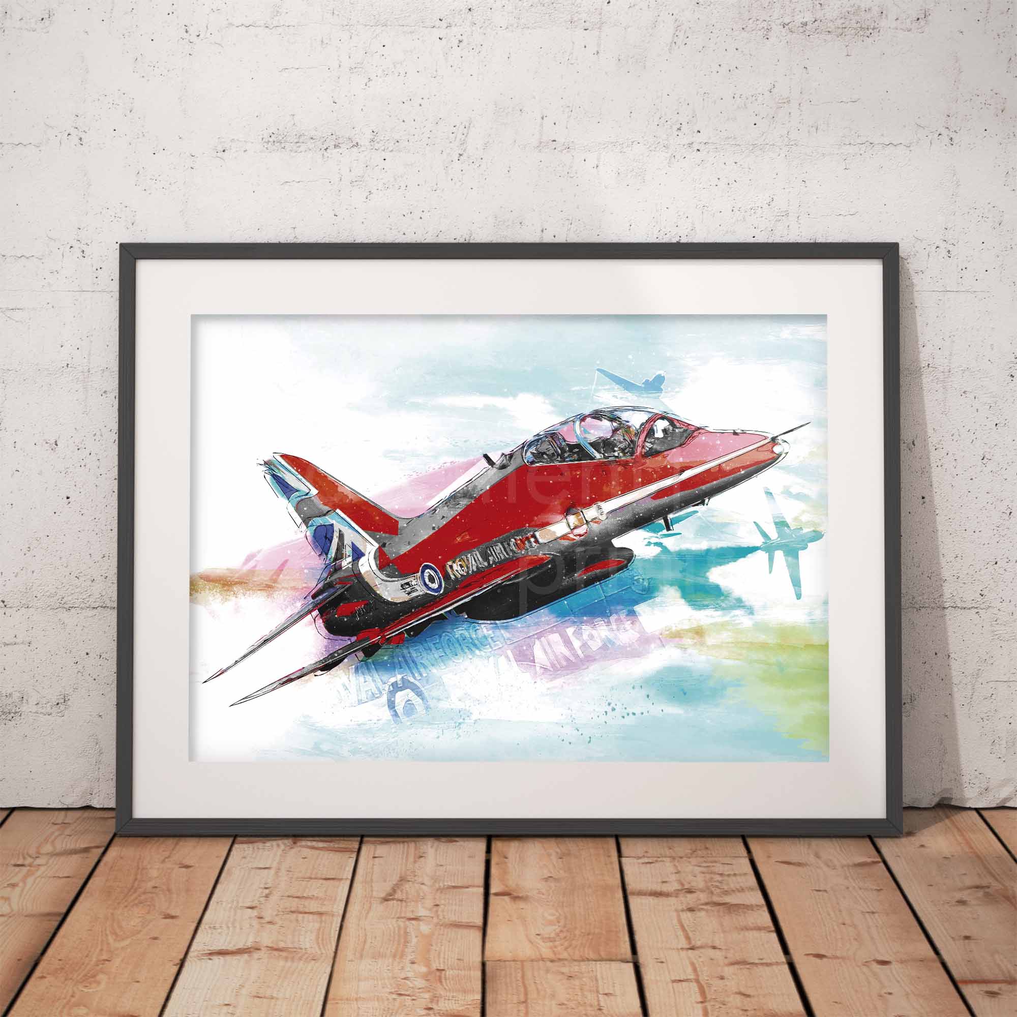 Framed artwork of a Red Arrows aircraft on a white wall with wooden floor