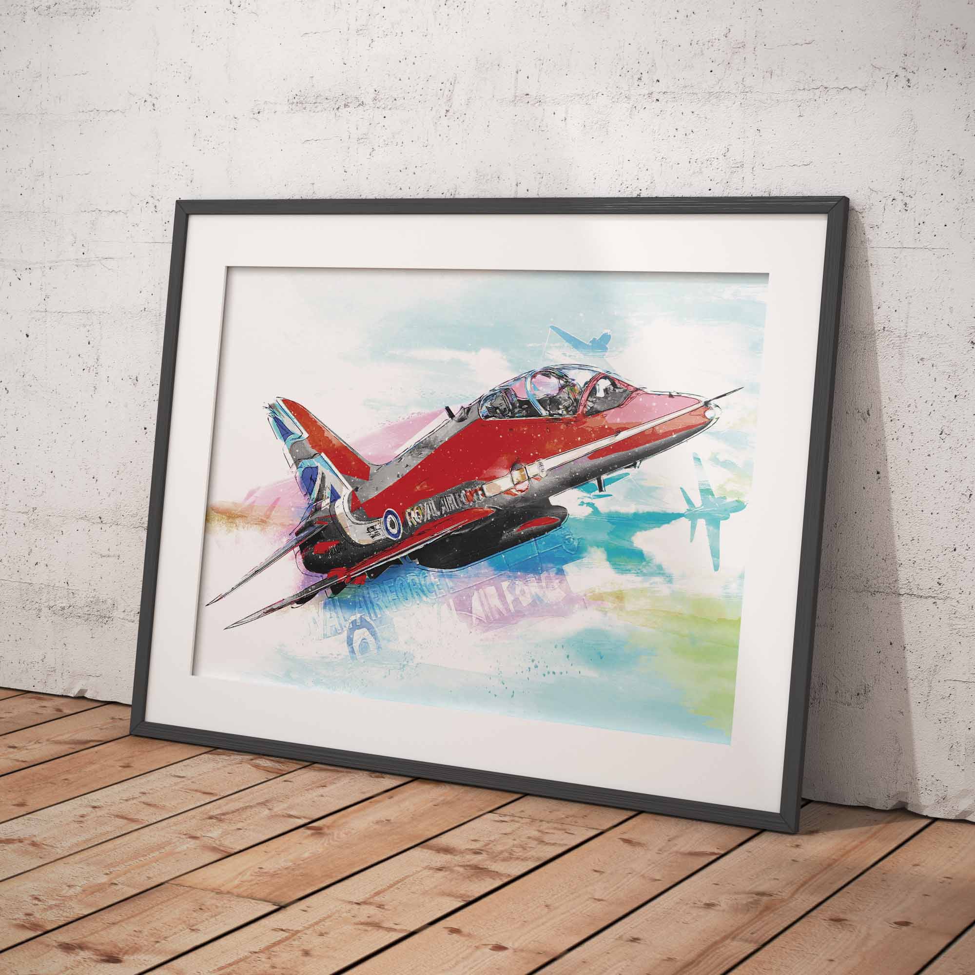 Framed artwork of a Red Arrows aircraft on a white brick wall with wooden floor
