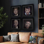 Framed portraits of each member of The Rolling Stones on a wall above a couch with decorative pillows.