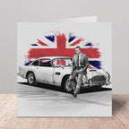 Greeting card with a James Bond standing next to a classic car against a Union Jack background.