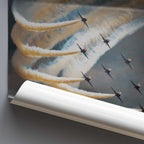 Roll of paper with a printed design of fighter jets and smoke trails on a dark background