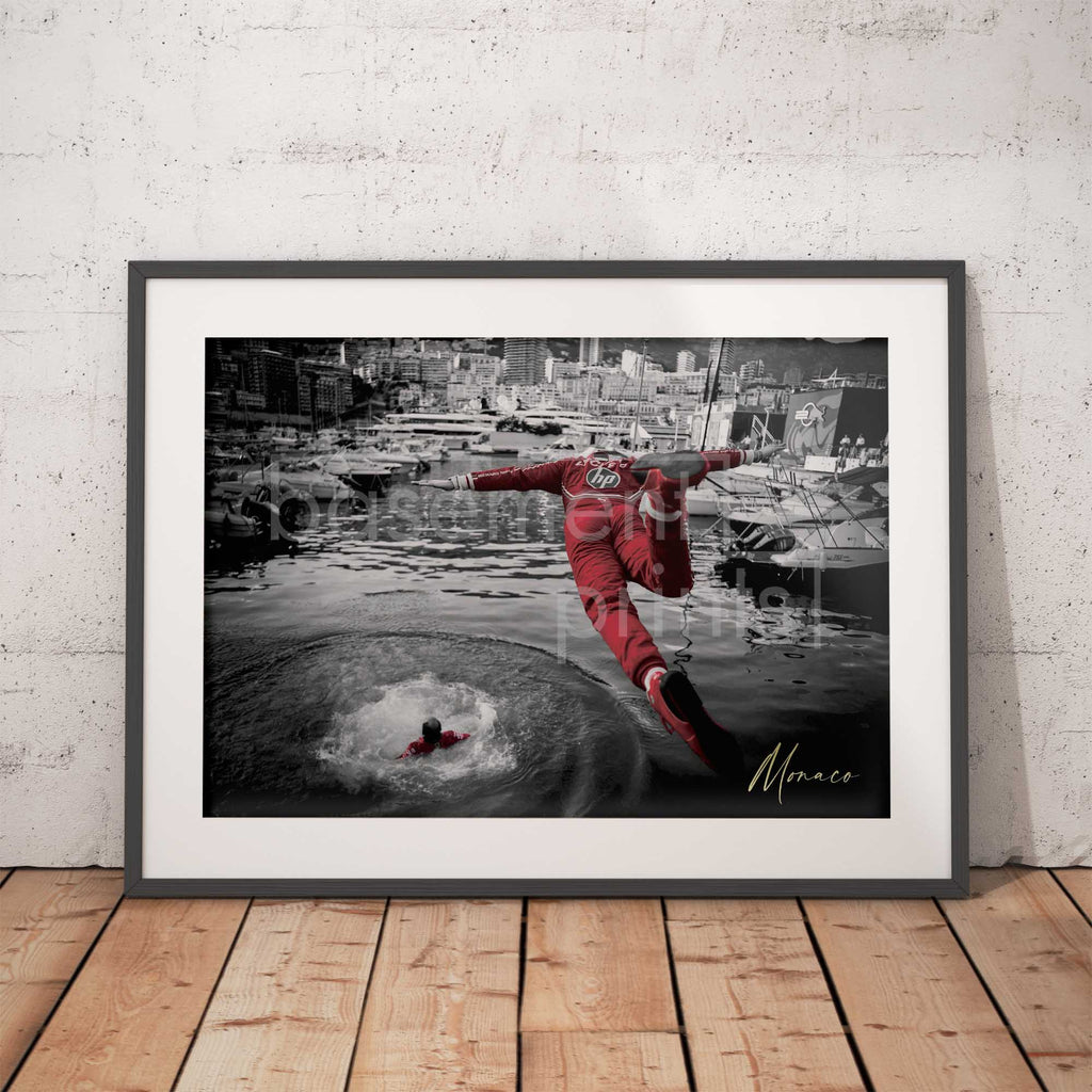 Photograph of a Charles Leclerc diving in to the Monaco harbour