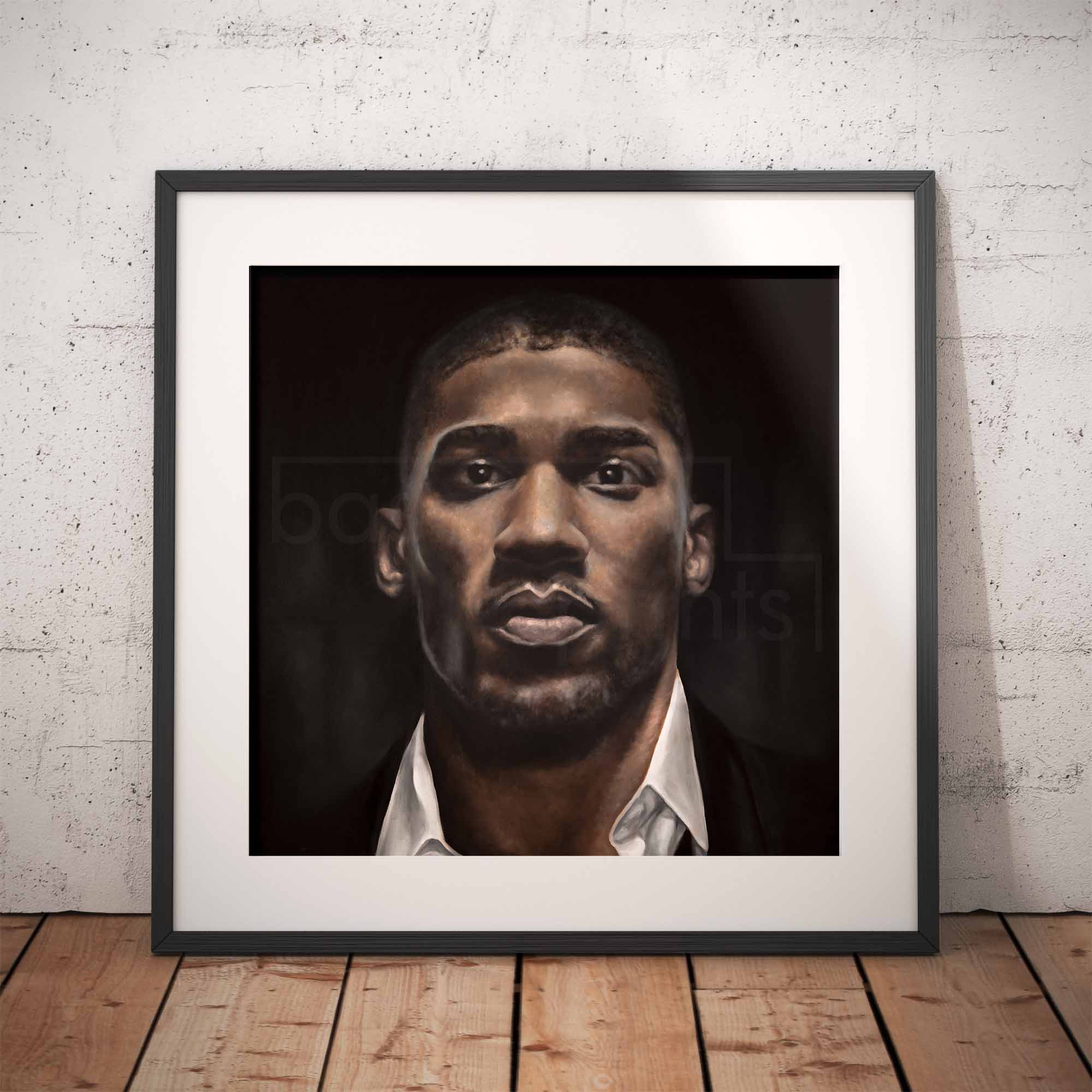 Framed oil painting of the heavyweight boxer Anthony Joshua leaning against a white brick wall.