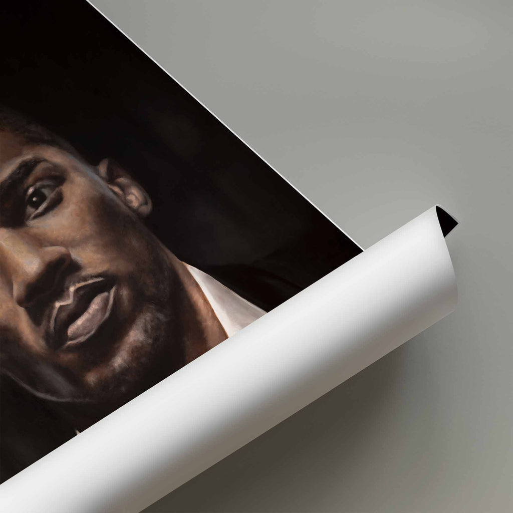 Rolled poster of the boxer Anthony Joshua on a grey background.
