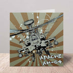 A square art print or card featuring a detailed illustration of an Apache AH-64 military attack helicopter over a brown and beige sunburst background, with the text 'APACHE AH-64' in the lower right, displayed on a wooden surface against a neutral wall.