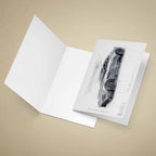 Open greeting card with James Bonds Aston Martin DB10 car on a beige background