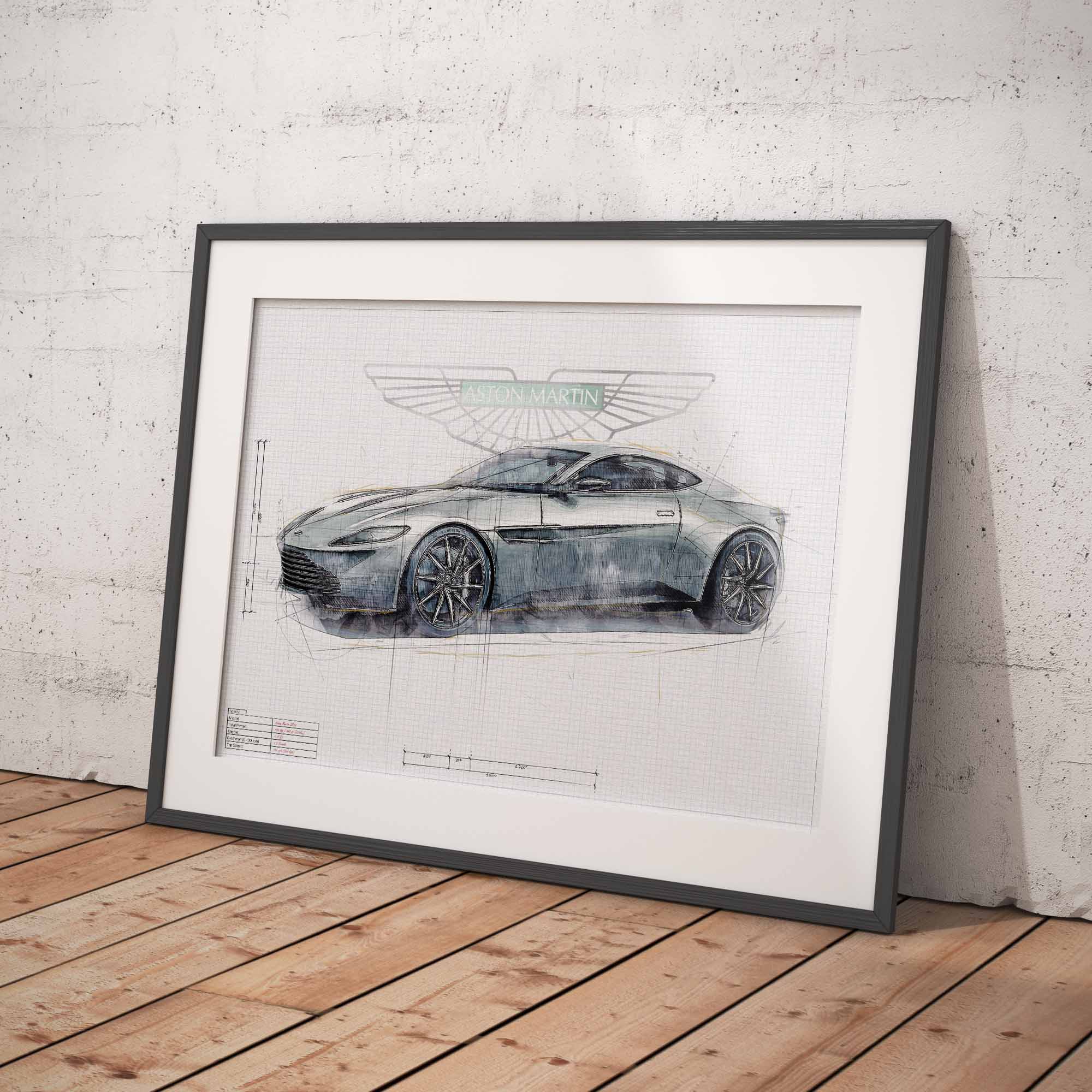 Framed artowrk of James Bonds Aston Martin DB10 car blueprint on a wooden floor against a white brick wall.