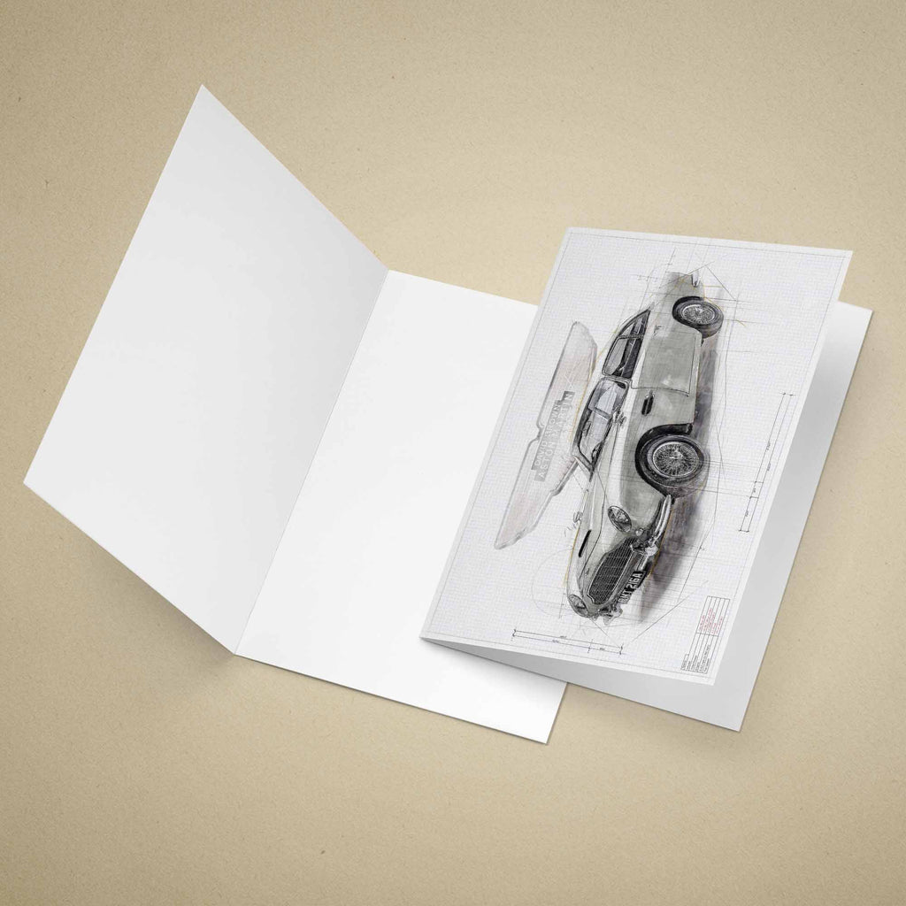 Open greeting card with James Bonds Aston Martin DB5 car on a beige background