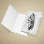 Open greeting card with James Bonds Aston Martin DB5 car on a beige background