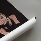 Roll of paper with a portrait of Audrey Hepburn on a gray background