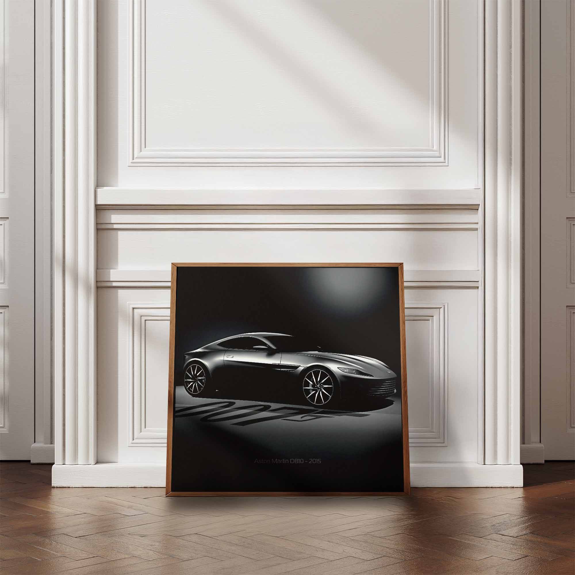 Framed artwork of James Bonds Aston Martin DB10 against a wall in a room with wooden flooring and white walls.