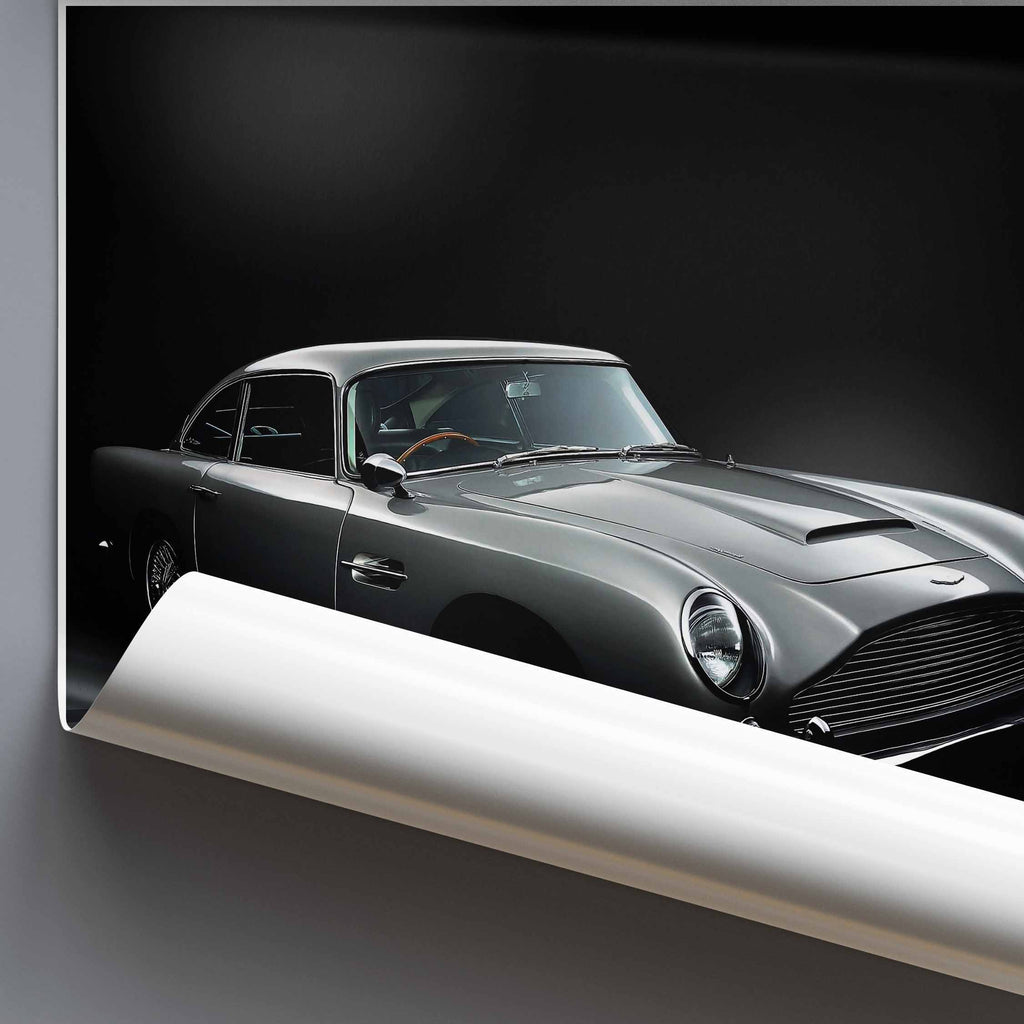 Rolled poster of artwork of James Bonds Aston Martin DB5 on a dark background
