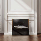 Framede artwork of James Bonds Lotus Esprit S1 car on a wall with wooden floor and white walls.