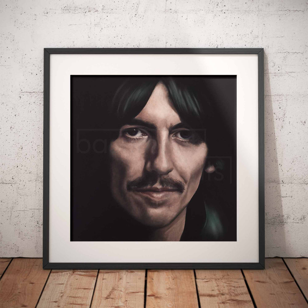 Framed portrait of George Harrison with on a textured wall.