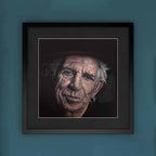 Framed portrait of Keith Richards on a blue wall