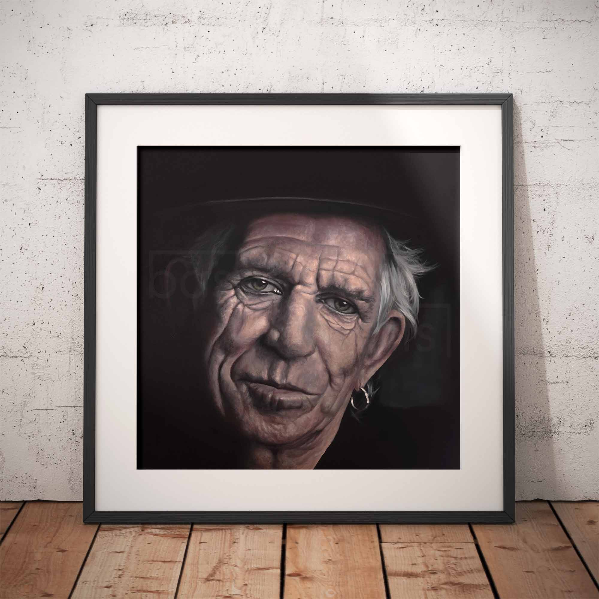 Framed portrait of Keith Richards against a white brick wall.