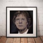 Framed portrait of Mick Jagger on a wooden floor with a white brick wall background
