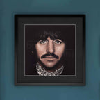 Framed portrait of Ringo Starr on a blue wall