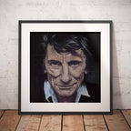 Framed portrait of Ronnie Wood on a brick wall background