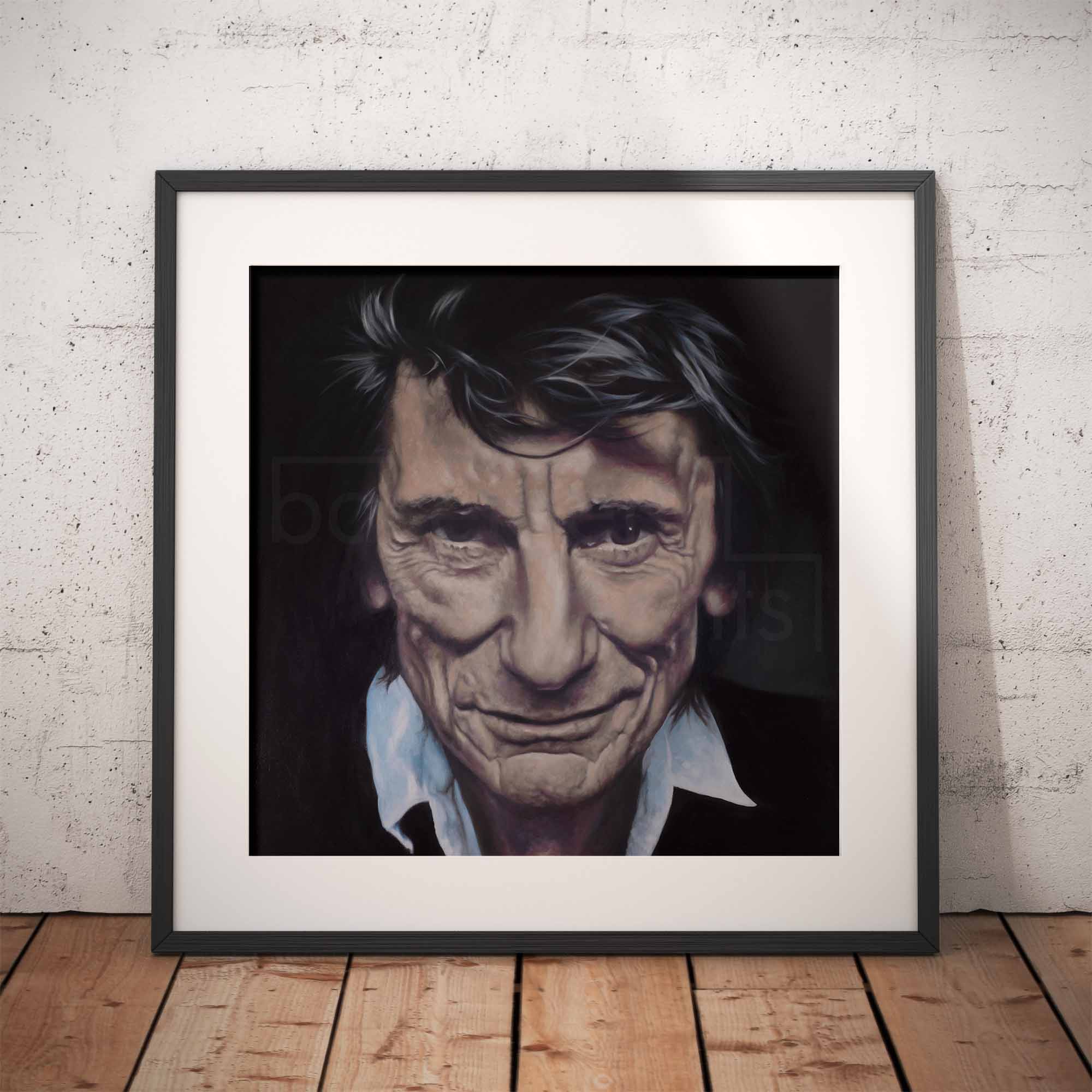 Framed portrait of Ronnie Wood on a brick wall background