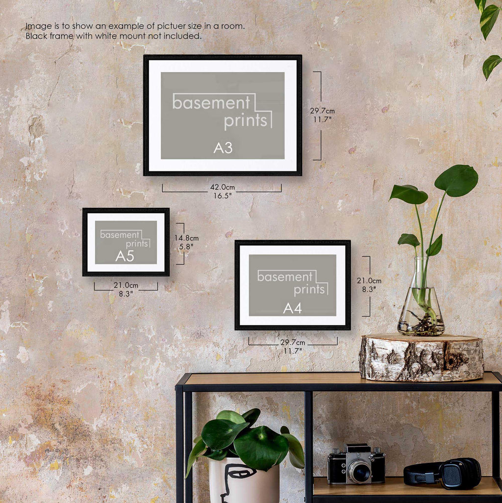Framed landscape prints labelled A3, A4, and A5 on a wall with a shelf below.