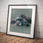 Framed artwork of a cockapoo dog in watercolour on a wooden floor with a white brick wall background