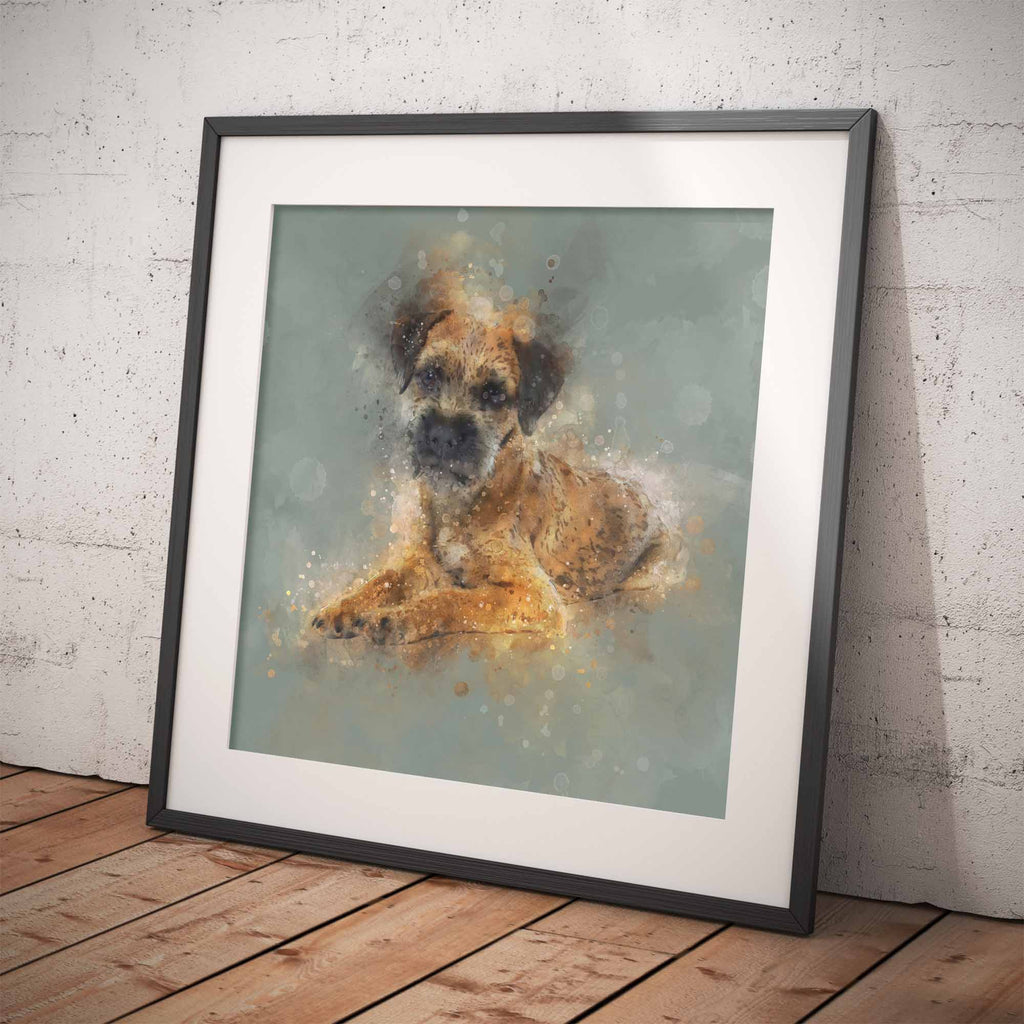 Framed artwork of a Border Terrier dog on a textured wall and wooden floor.