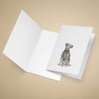 Greeting card with a Border Terrier on a beige background