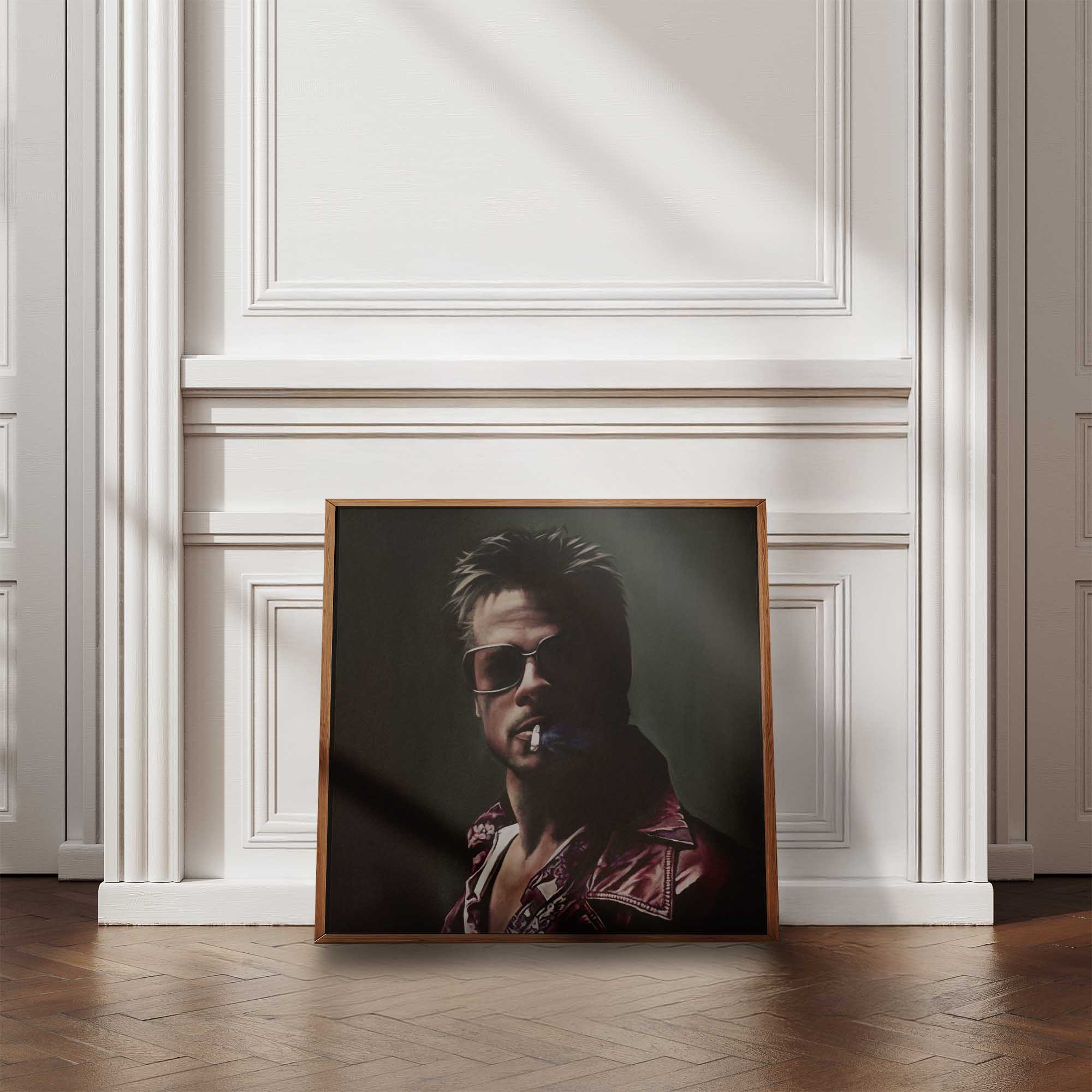 Framed portrait of a stylish man with sunglasses and a cigarette against a white wall.