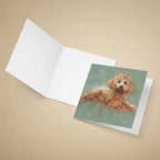 Greeting card with a Cavapoo dog illustration on a beige background