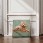 Framed artwork of a Cavapoo dog on a textured wall and wooden floor.