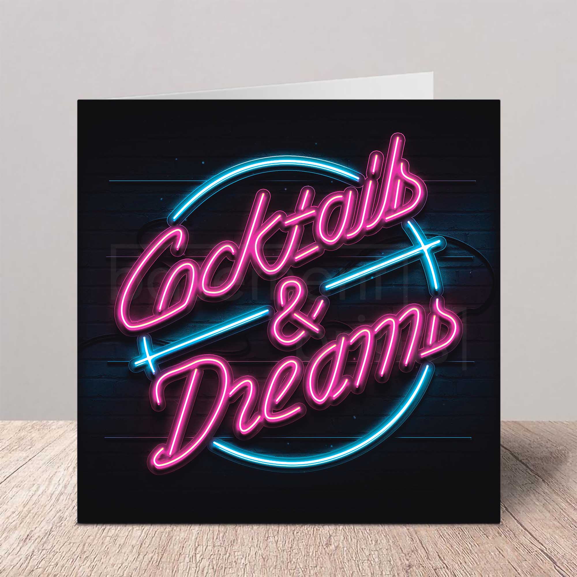 Neon-style card with 'Cocktails & Dreams' text on a black background