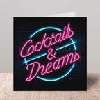 Neon-style card with 'Cocktails & Dreams' text on a black background