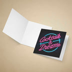 Greeting card with 'Cocktails & Dreams' neon-style text on a beige background