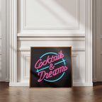 Neon sign with 'Cocktails & Dreams' on a wall with panelling.
