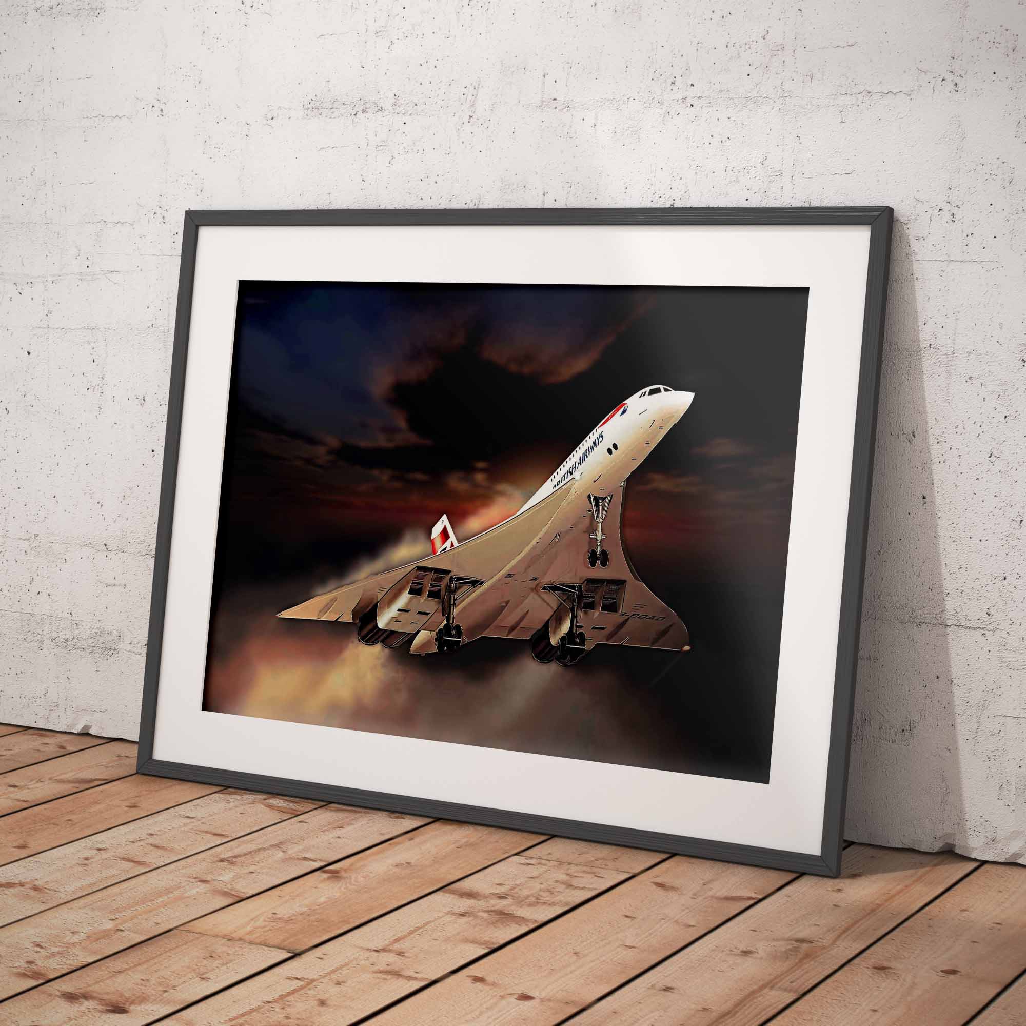 A framed art print of a Concorde supersonic jet against a dramatic sunset sky, leaning against a textured concrete wall on a wooden floor.