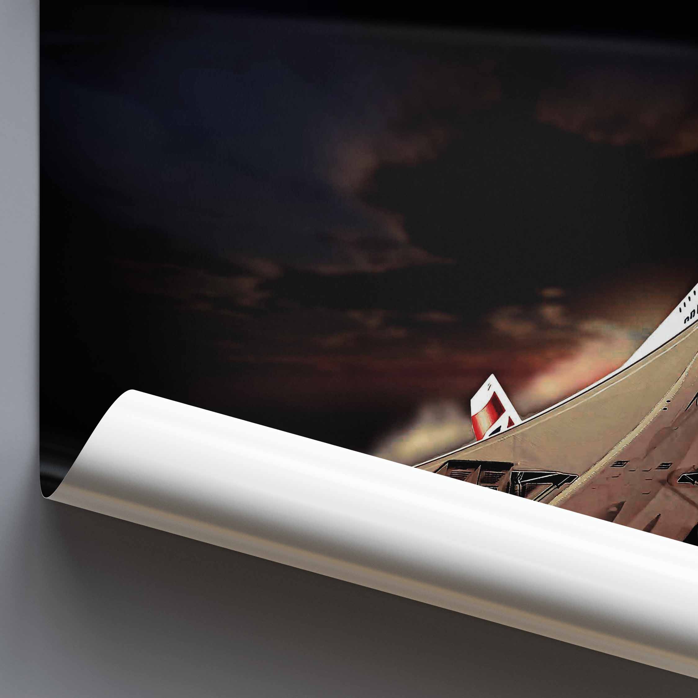 A rolled poster or wall art print is shown partially unrolled against a dark dramatic sky scene featuring an illustration of a Concorde supersonic jet taking off against a dark, smoky sky, displayed on a grey surface.