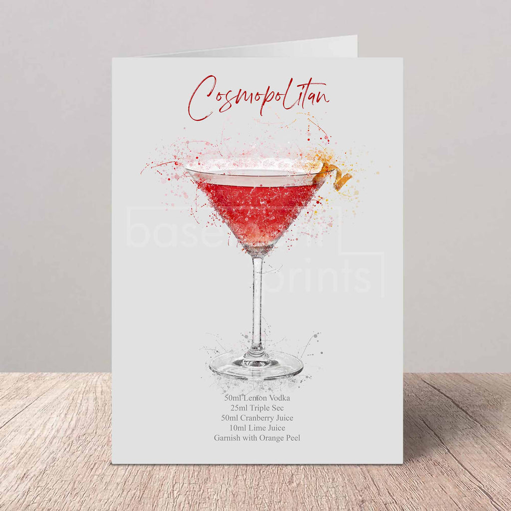 Greeting card with a cosmopolitan cocktail illustration on a wooden surface.