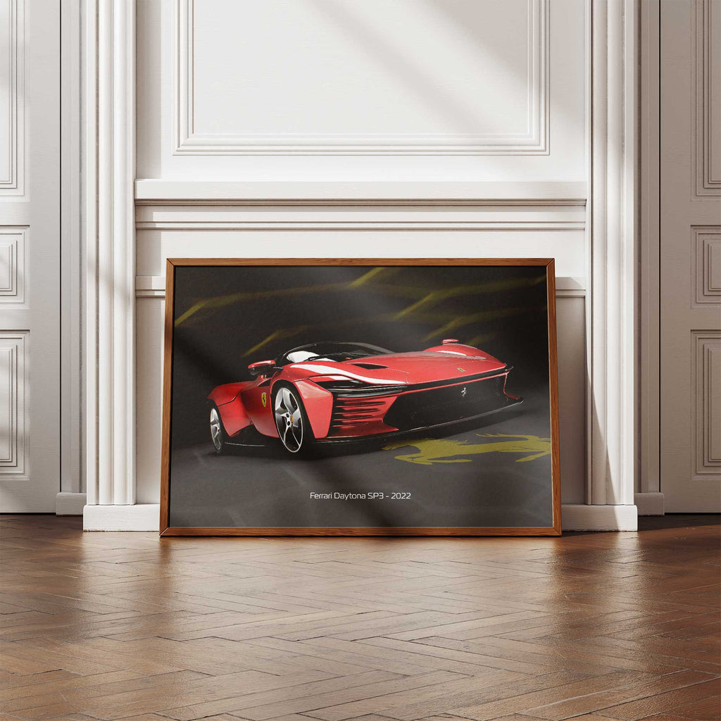 Framed poster of a red Ferrari SP3 on a wall in a room with wooden flooring.